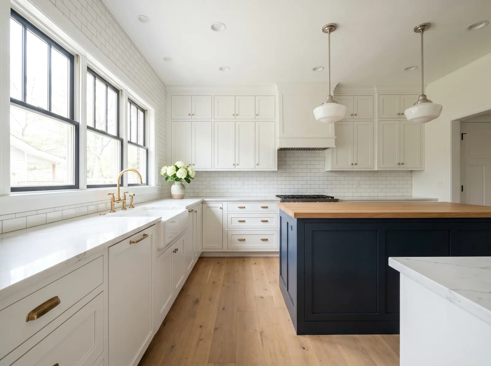 Finished kitchen renovation in Richmond Northside — light cabinetry, butcher-block island, oak floors